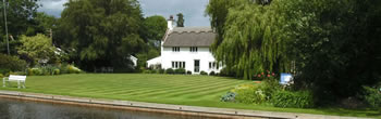 Dyke leading to Womack Water, an ideal mooring spot for Norfolk Broads hire boats